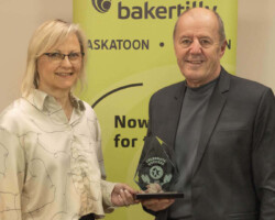 Award of Excellence Connie Brown from Parkland College presents the Award of Excellence to D's Signs & Designs