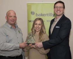 Customer Service Award Lorrie Ulmer from RBC Royal Bank presents the Customer Service Award to Hearn's Westview Pharmacy