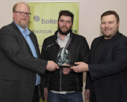 Large Business of the Year Award Ryan Hoffman from Baker Tilly presents the Large Business of the Year Award to NL Construction Inc