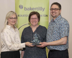 Award of Excellence Connie Brown from Parkland College presents the Award of Excellence to Truck Pro