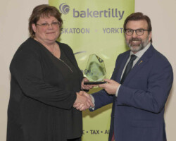 Community Merit Award Yorkton Exhibition Association accepts the Community Merit Award sponsored by SaskTel from Greg Ottenbreit, MLA