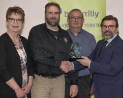Community Merit Award Yorkton Lions Club accepts the Community Merit Award sponsored by SaskTel from Greg Ottenbreit, MLA