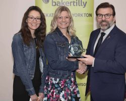 Community Merit Award Yorkton Nursery School Cooperative accepts the Community Merit Award from Greg Ottenbreit. MLA on behalf of SaskTel