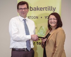 Award of Excellence Award of Excellence – Key Auto Group: Joel Martinuk of Key Auto Group accepts the Award of Excellence presented by Kami De Pape of Suncrest College.