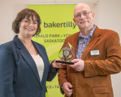 Jenna Niebergall of Suncrest College presented the Award of Excellence to Bob Paton of Auto Electric Service and Mainline Fleet Service.