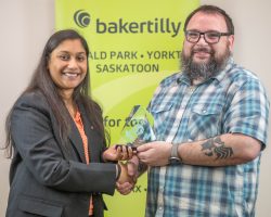 Thushara Ajit Kumar Sunitha of Scotiabank presented the Retail & Consumer Award to Curtis Hart of Mark’s Yorkton.