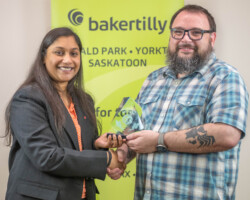 Thushara Ajit Kumar Sunitha of Scotiabank presented the Retail & Consumer Award to Curtis Hart of Mark’s Yorkton.