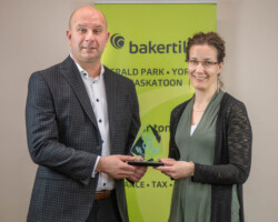 Ryan Kitchen of Baker Tilly presented the Small Business of the Year Award to Sumita Hintz of Prairie View Physiotherapy Prof Corp.