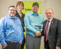 Vetted HVAC Services accepted the Trades & Skilled Labour Award presented by Gord Dobrowolsky, Chair of the Board Worksafe Saskatchewan.