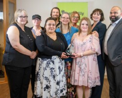 Jenna Niebergall of Suncrest College presented the Award of Excellence to the staff of Venvi The Bentley.
